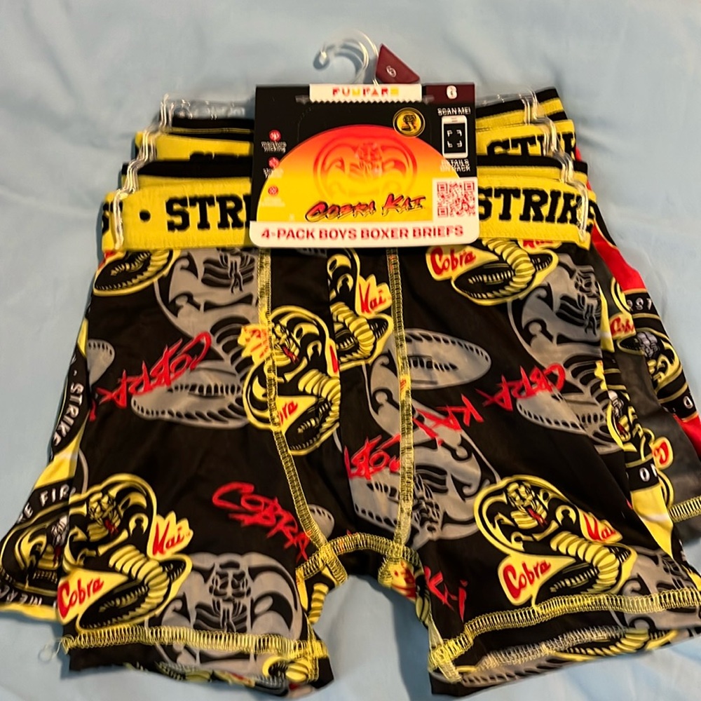A four pack boys size 6, boxer, briefs, cobra, Kai
